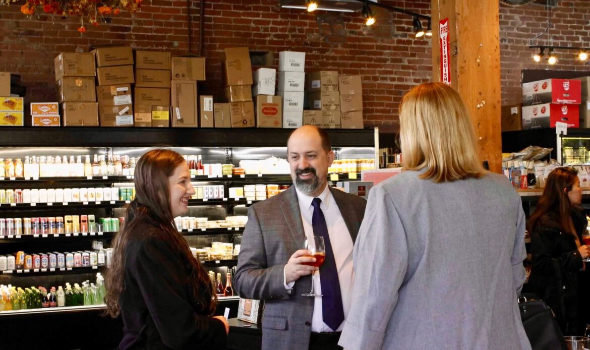 Image of three people talking