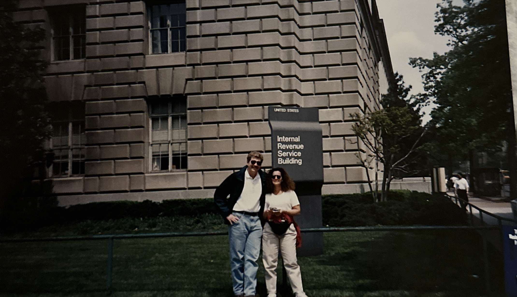 A couple standing outside building